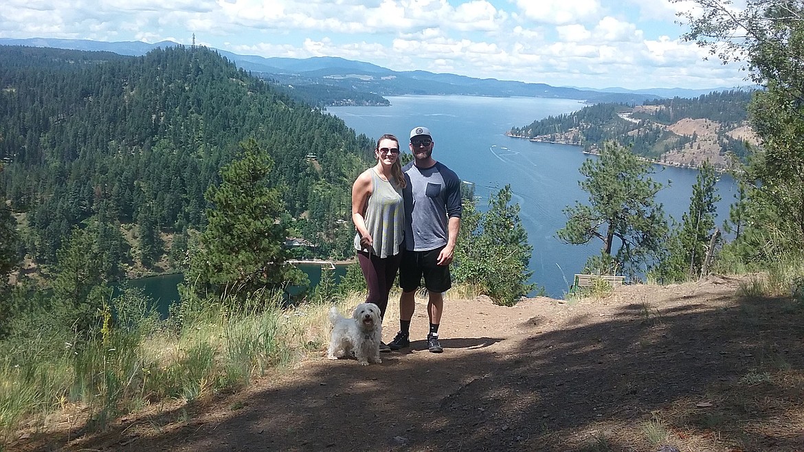 Photos by JERRY HITCHCOCK/Press
Journey joins Jaclyn Hitchcock and boyfriend Chris Mahana after reaching the top of the Mineral Ridge trail on a recent hike east of Coeur d&#146;Alene.