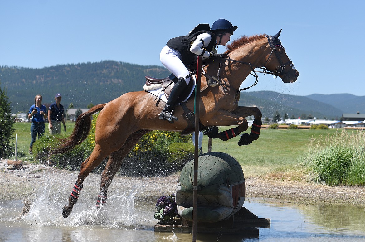 Natasha Knight on Harbour the Truth jumps over an obstacle during the junior&#146;s cross country event at Rebecca Farm on Saturday. (Aaric Bryan/Daily Inter Lake)