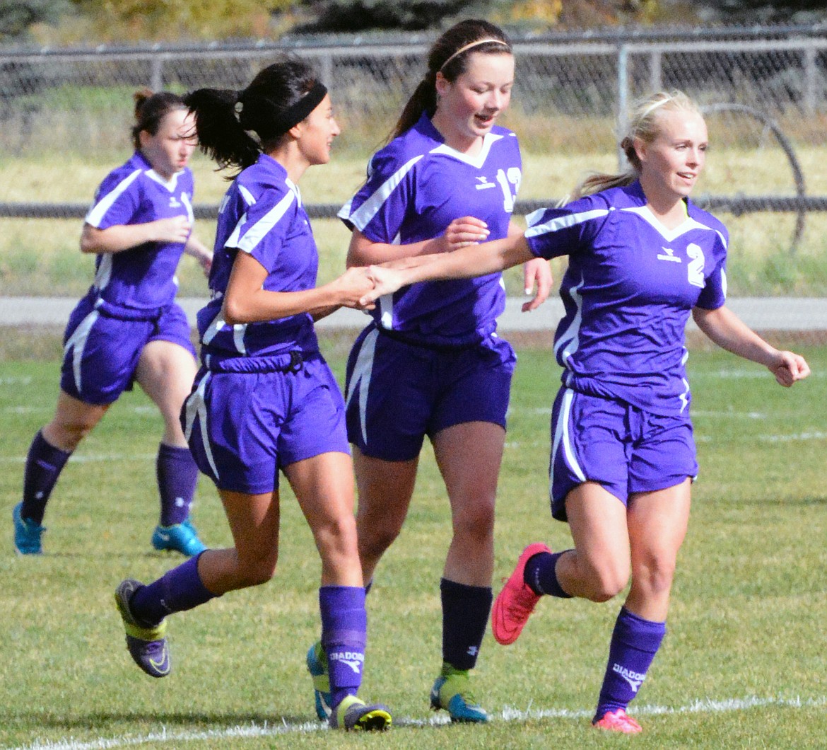 FORMER POLSON Pirate Tiarra Duford celebrates with her teammates after she scored a goal during last season&#146;s Class A playoffs against Hamilton. (photo by Jason Blasco/Lake County Leader)