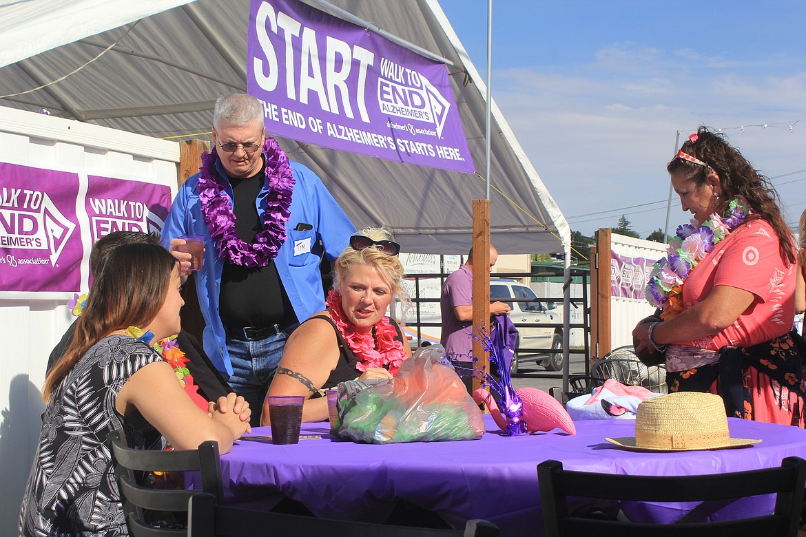 Richard Byrd/Columbia Basin Herald
Attendees at Thursday night&#146;s Purple Party in Moses Lake were decked out in purple and Hawaiian attire.