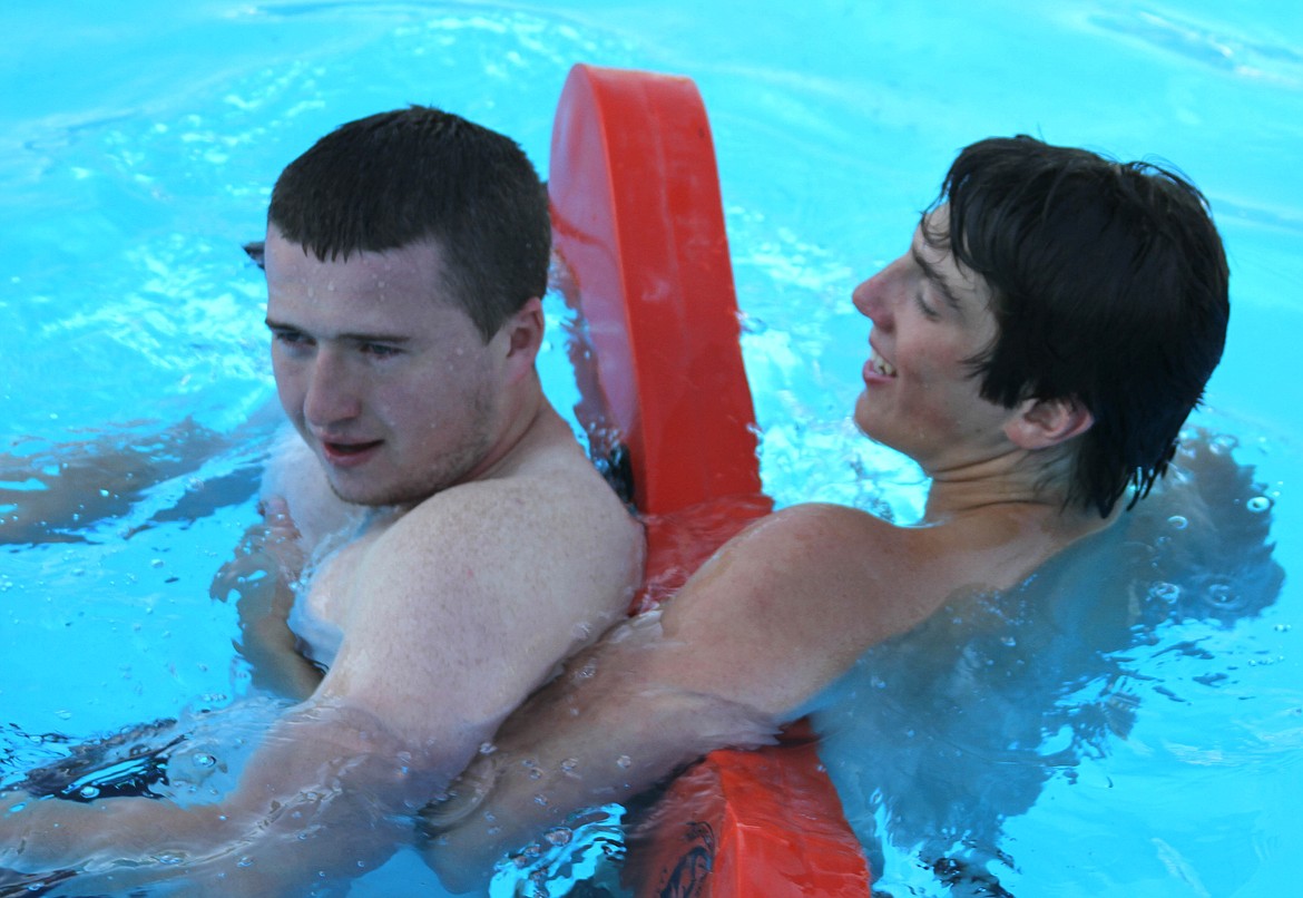 photos by Josh McDonald
Austin Myles and lifeguard Gaving Luna share a brief laugh after Luna recovered Myles from the bottom of the 12 foot section of the pool during the lifeguards inservice training.