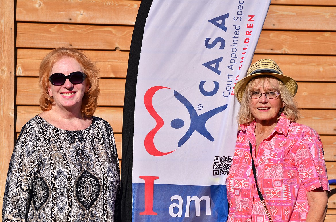 CASA Advocate Volunteers Becky Azure (left) and Linda Wilson (right) were sharing plenty of smiles with event goers