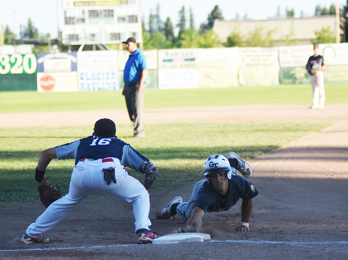 The Twins&#146; Thomas Hellwig dives back to first after a pick off attempt by the Red Sox Saturday night at Memorial Field.