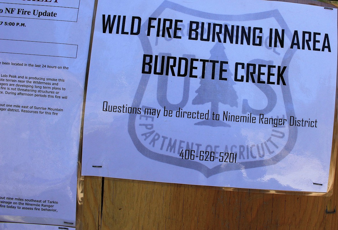 Travelers at Fish Creek were greeted by signs warning about the Burdette Fire burning south of the creek. As of Sunday, the fire had grown to 440 acres, with threats of it spreading into Petty Creek. (Kathleen Woodford/Mineral Independent)