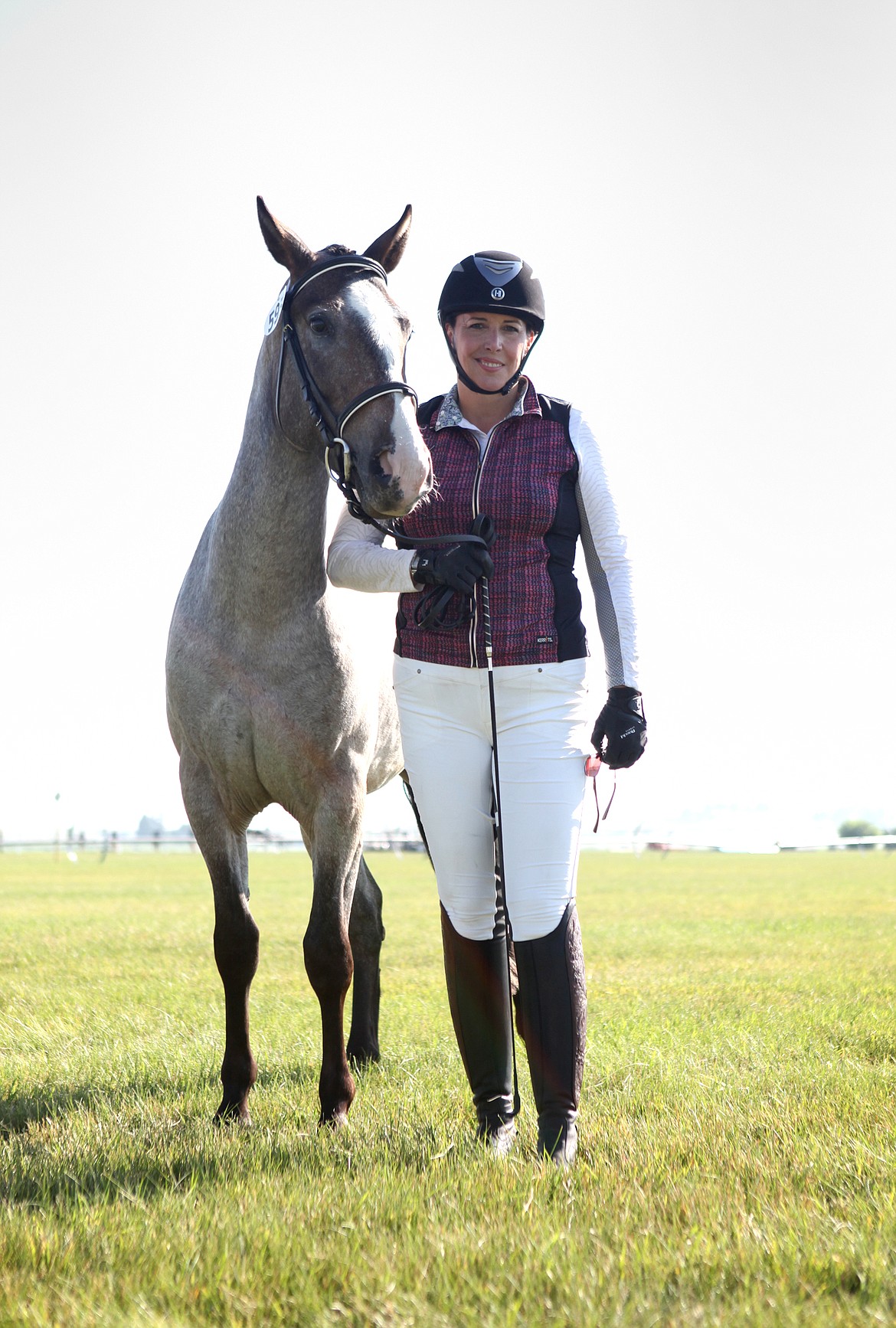 Livingston's Michelle Donaldson poses with her rescue horse, Twisted Oliver, after the pair competed in the future event horse, 2-year-old division, at Rebecca Farm July 18. (Mackenzie Reiss/Daily Inter Lake)