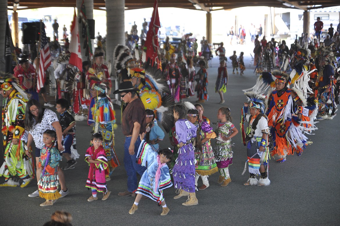 BRILLIANTLY dressed tribal members of all ages participated in a Grand Entrance, a procession to a beat set by drummers Friday evening. (Ashley Fox/Lake County Leader)