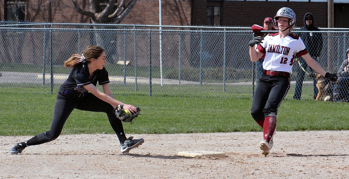 POLSON HIGH School softball player Kaelyn Smith attempts to tag out a Hamilton runner in a regular season game. (photo by Jason Blasco/Lake County Leader)