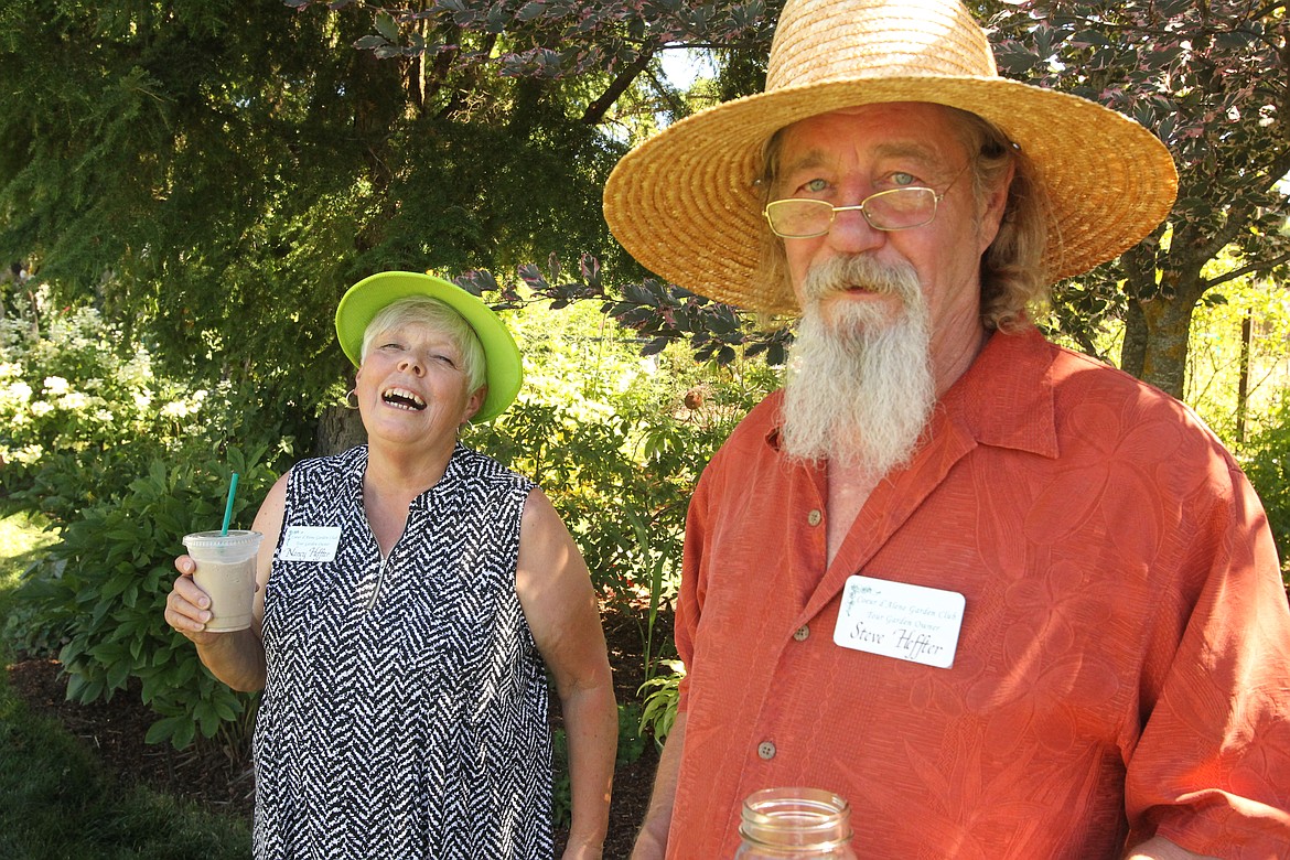 MITCHELL BONDS/Press
Nancy and Steve Heffter chat with guests in their garden Sunday during the 20th annual Garden Tour.