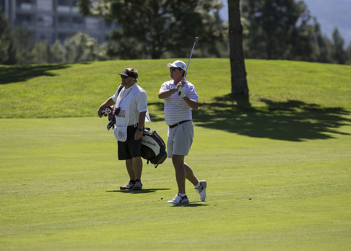 LOREN BENOIT/Press
NHL Hall of Famer Wayne Gretzky watches his approach shot to the first hole Saturday afternoon during The Showcase.