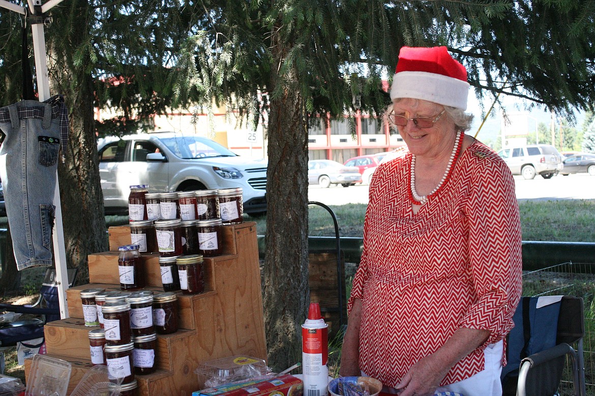 Helen Tarbert, Libby farmer&#146;s market assistant, poses at her booth July 13 at the market&#146;s Christmas in July event. (Elka Wood/The Western News)