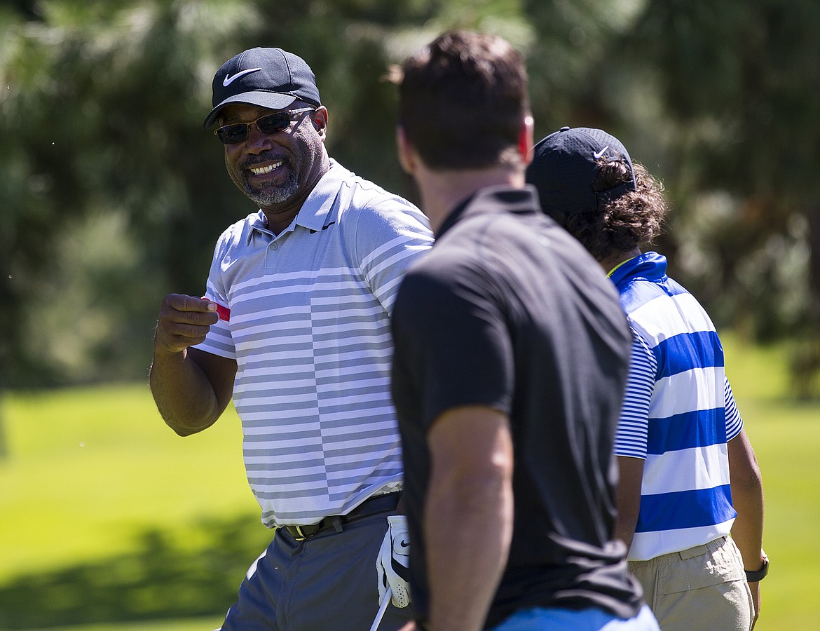 LOREN BENOIT/Press
American singer/songwriter Darius Rucker jokes with NHL player Tyler Johnson while on the first hole during The Showcase on Saturday at The Coeur d&#146;Alene Resort Golf Course.