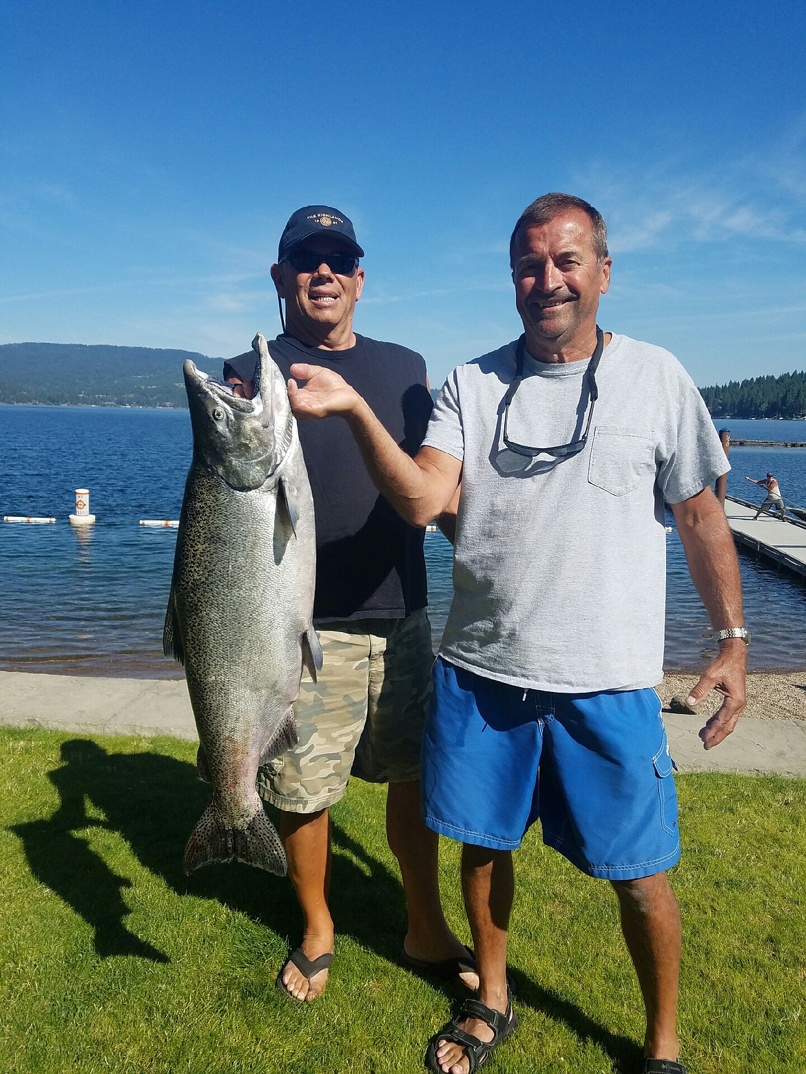 Courtesy photo 

Andy Hopek holds the 23.56-pound, 35 1/2-inch chinook salmon he caught during this week's Big One Derby on Lake Coeur d'Alene. Beside him is Bob Van Wie. Hopek's catch is keeping him in the No. 1 spot on the derby leaderboard as the event heads into the weekend. The derby runs through Sunday.