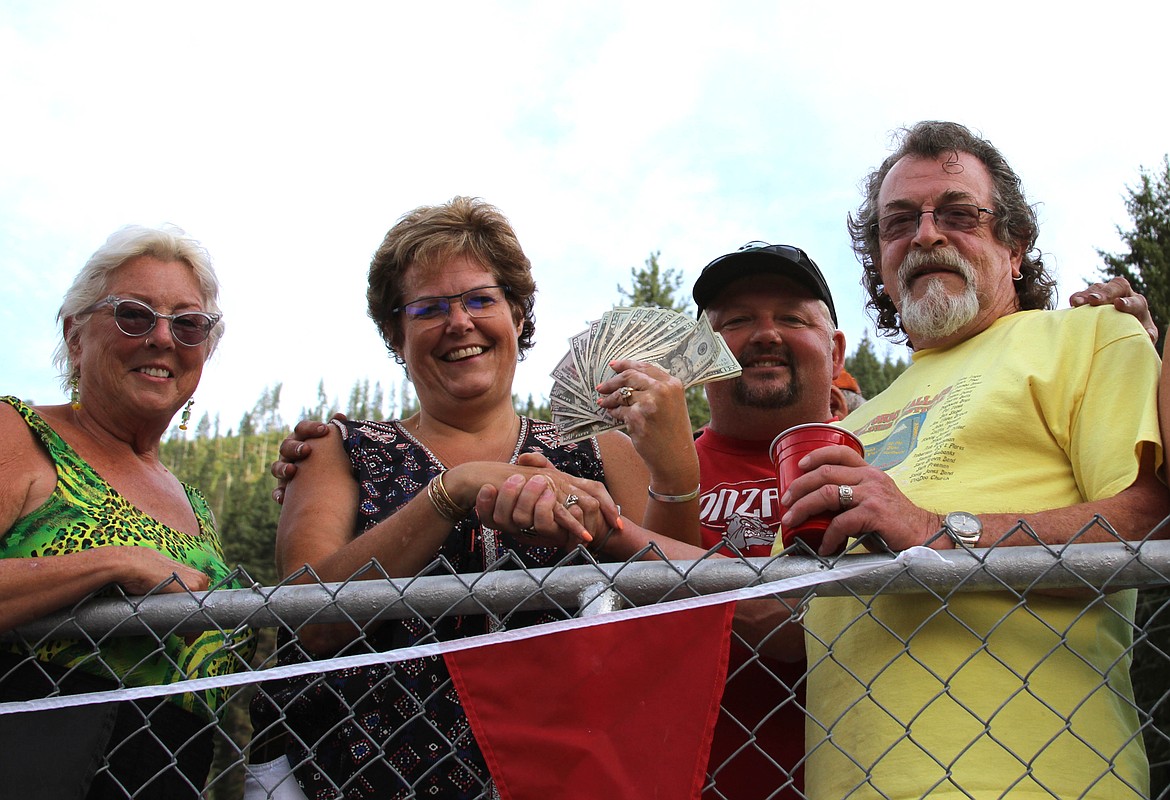 Marcy Hayman with The Metals Bar presented Wallace Blues Fest board member Tommy Hayes with a $1,000 cash donation. Also pictured are Jackie Hayes and Mike Hayman.