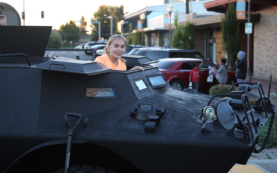 Herald file photo
Frontier MIddle School seventh grader Emma Glencoe takes a look out the Moses Lake Tactical Response Team&#146;s V150 Armored Vehicle Tuesday night at last year&#146;s National Night Out celebration.