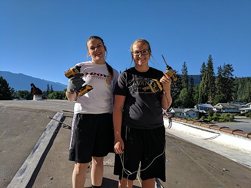 Students workers at Troy high school, Taylor Carter and Kylie Carr, on the roof of the old high school building on July 25.