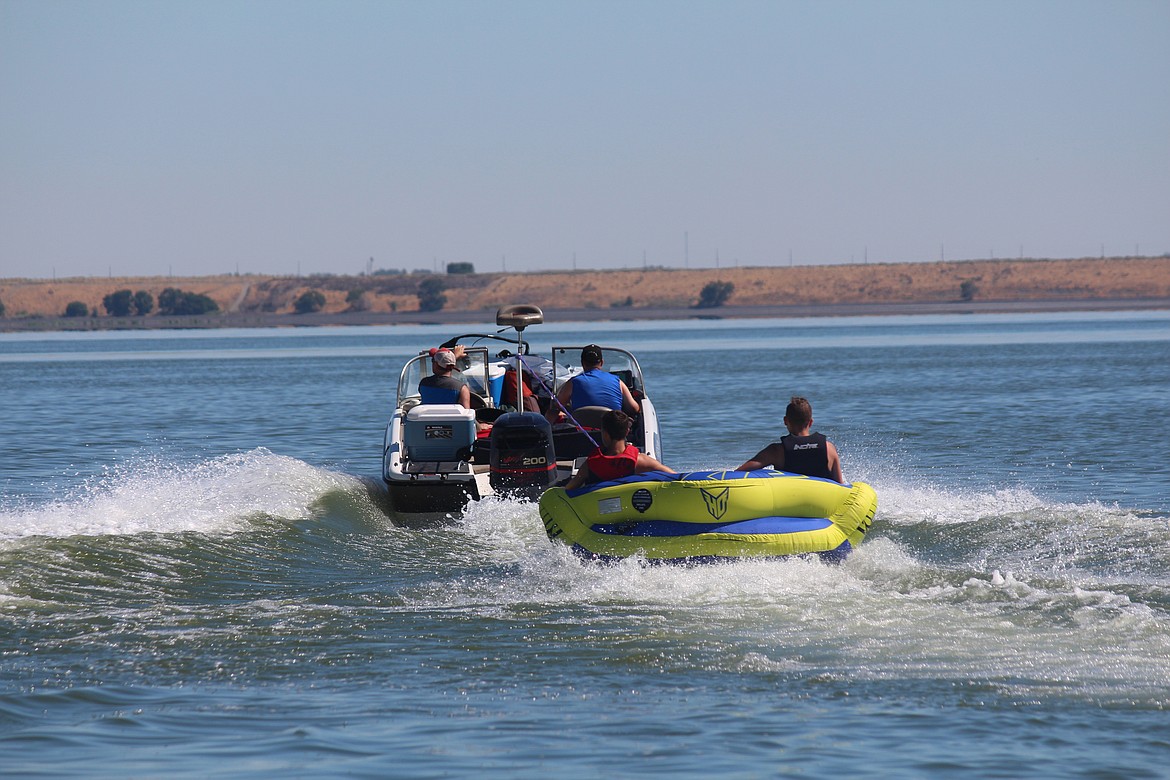 Cheryl Schweizer/Columbia Basin Herald
A boat heads out for a day on the lake at the Potholes Friday.