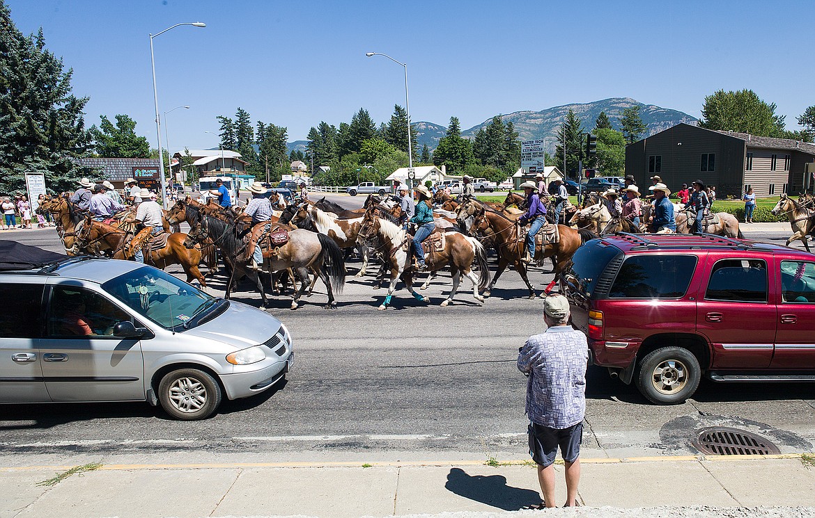 Watching the Freedom Bank wild horse drive down U.S. Highway 2 after the parade.