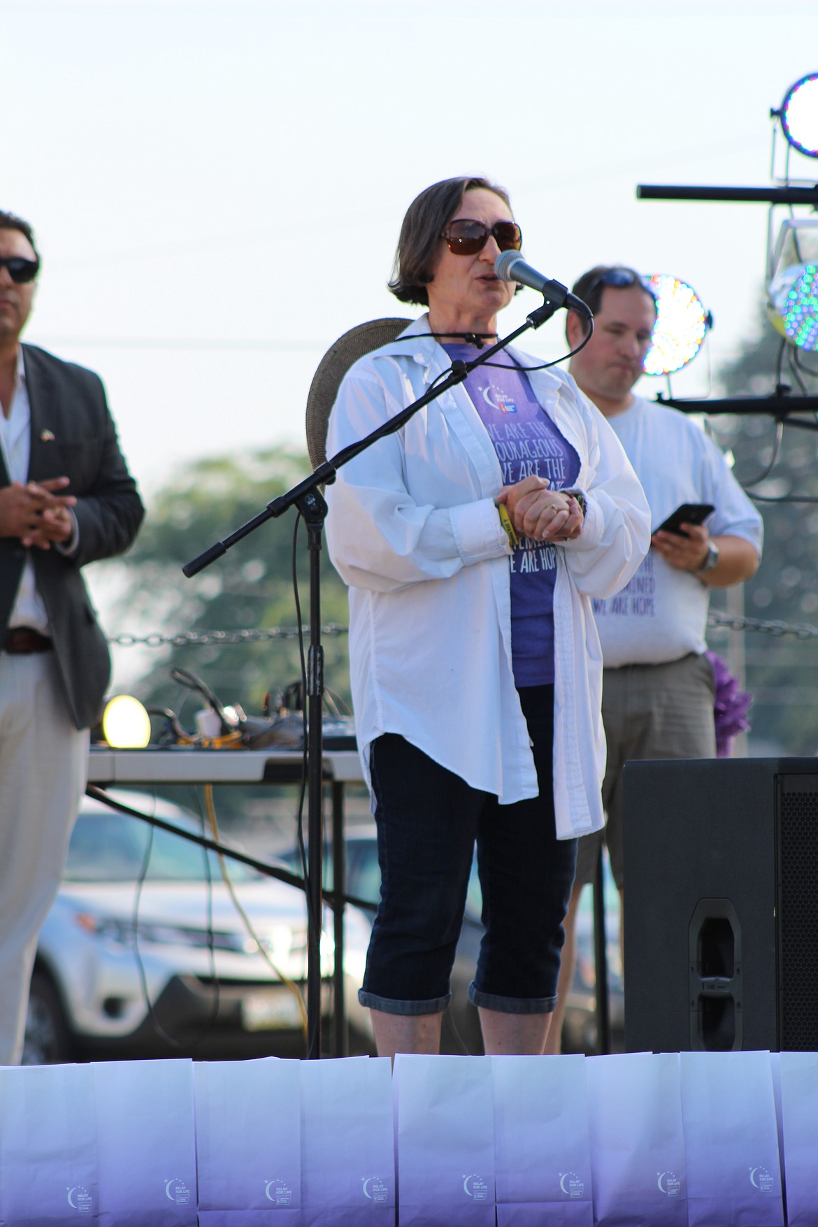 Chanet Stevenson/The Sun Tribune - Edie Borgman recounts her own battle with skin cancer, encouraging others to get checked for early detection. She also thanked fellow cancer survivors for joining in for the evening. &quot;You're the reason that we do this event each year,&quot; she said.