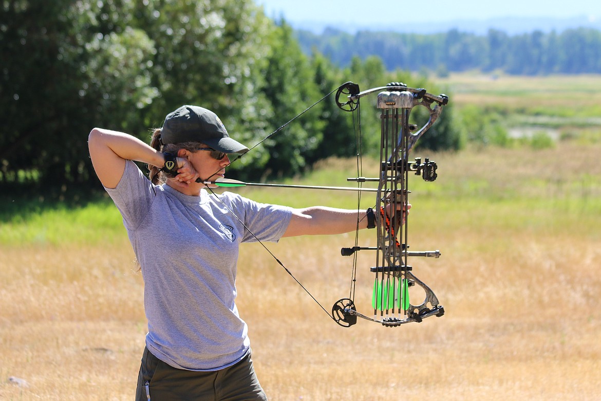 (Photo by MANDI BATEMAN)
Instructor and Idaho Fish and Game Senior Conservation Officer Julie Lininger demonstrates how it is done with her own bow.