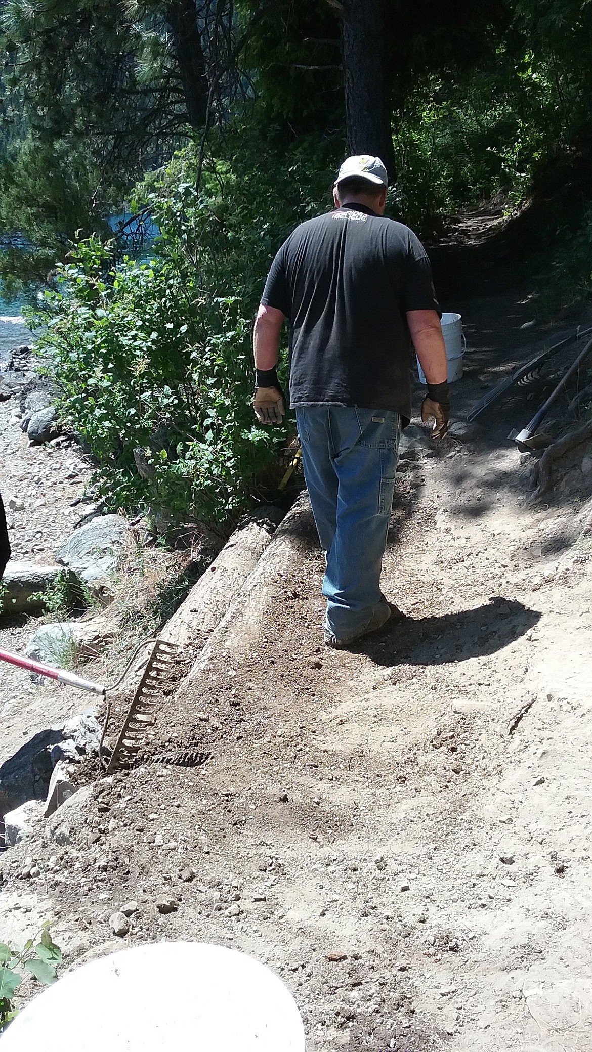 JERRY HITCHCOCK/Press
John Bowman tamps down a newly-rebuilt area of the Shoreline Trail at Farragut State Park.