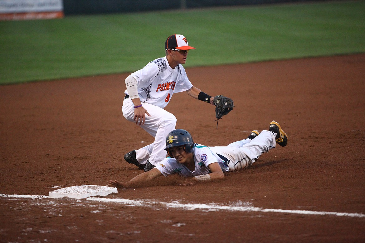 Rodney Harwood/Columbia Basin Herald
Moses Lake runner Cody Alvarado is tagged out by Vancouver third baseman Derek Mettler during the first inning of Tuesday night&#146;s Senior Babe Ruth World Series game in Ephrata.