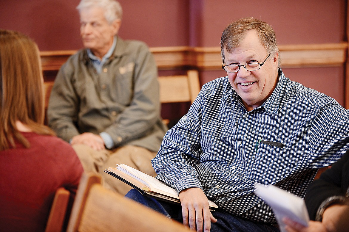 Flathead County Commissioner Phil Mitchell takes notes at a meeting on Monday, Dec. 29, 2014 in Kalispell. (Brenda Ahearn/Daily Inter Lake)