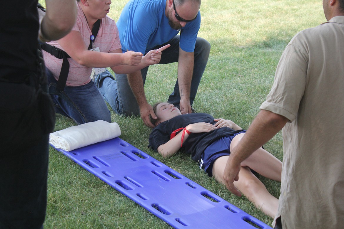 Richard Byrd/Columbia Basin Herald
First responders assess a patient&#146;s status during Tuesday&#146;s simulation.