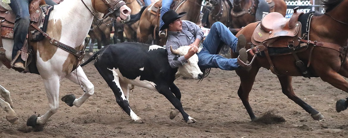 &#147;Make me a poster, of an old rodeo&#148; 

- John Prine


Ty Sherman, from Kennewick, Washington takes part in the steer wrestling portion of the Bonner County Rodeo on Friday night at the Fairgrounds. The action continues tonight, with the gates opening at 6 p.m. and the rodeo to follow at 7 p.m.

(Photo by ERIC PLUMMER)