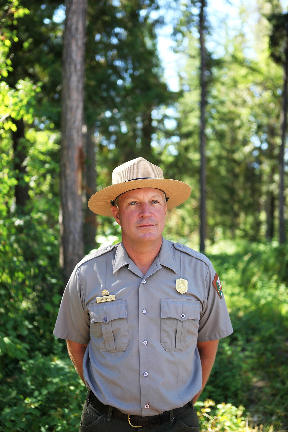 Glacier National Park wildlife biologist John Waller is pictured outside his office July 24. Waller has worked at the park for the past 16 years and specializes in grizzly bears. (Mackenzie Reiss/Daily Inter Lake)