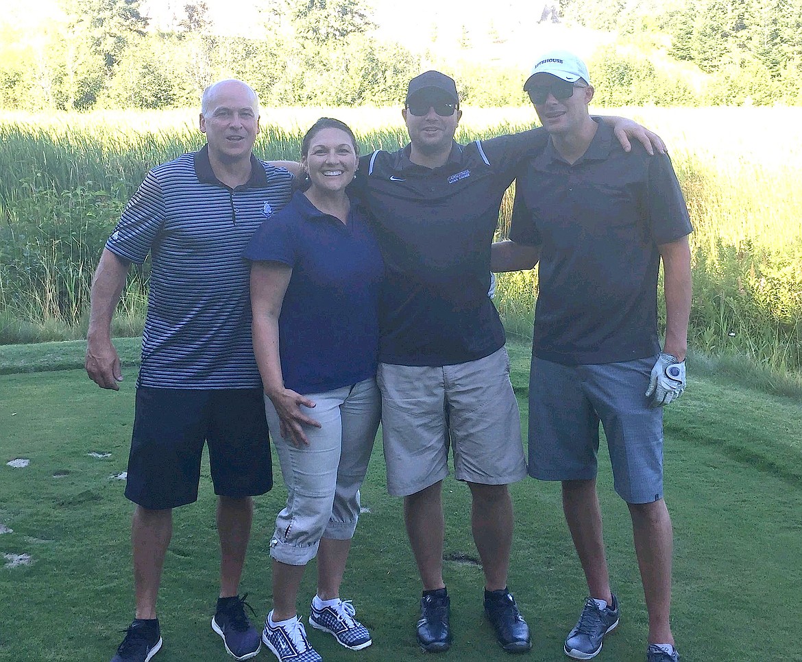 (Courtesy photo)
Pictured from left to right are Dan Munson, Charity Hegel, Luke Miller and Jake Oliver, who teamed up to win the recent Sandpoint Rotary Golf Tournament at the Idaho Club. Head pro Randi Fischer said the field was full for the first time the tourney has been held at the Jack Nicklaus course, with Tango Cafe providing the dinner that accompanied silent and live auctions. Proceeds from the tournament benefit local high school students. &#147;Thanks to everyone who participated and we look forward to next year,&#148; said Fischer. The Idaho Club will also host the 4A Idaho State Golf Championships in May, a first for Sandpoint, as golf teams from around the state will be competing.