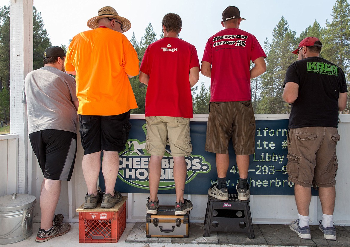 From left, Zach Sanderson, Richard Porter, Matt Dortmund, Dustin Denton and Troy Douthit remotely control their race cars around the dirt track.