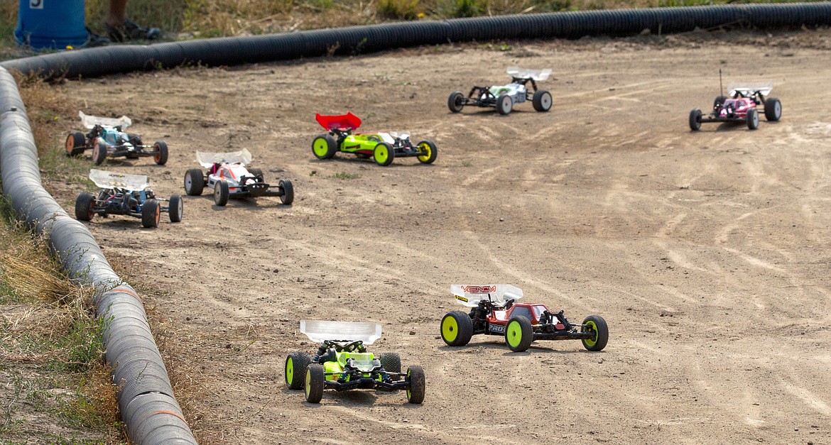 Remote-control race cars begin a practice lap during Hot August Showdown in Libby Saturday, Aug. 5. The annual event is held by Kootenai RC Racers.(John Blodgett photos/The Western News)