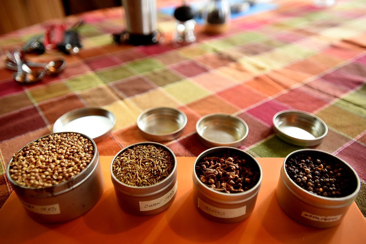 From left, coriander seeds, cumin seeds, cloves and black peppercorns are some of the ingredients that go into the making of the Basic Indian Masala taught by Julie Laing in the Twice as Tasty workshop on Indian Spices on Tuesday, July 10, in Whitefish.(Brenda Ahearn/Daily Inter Lake)
