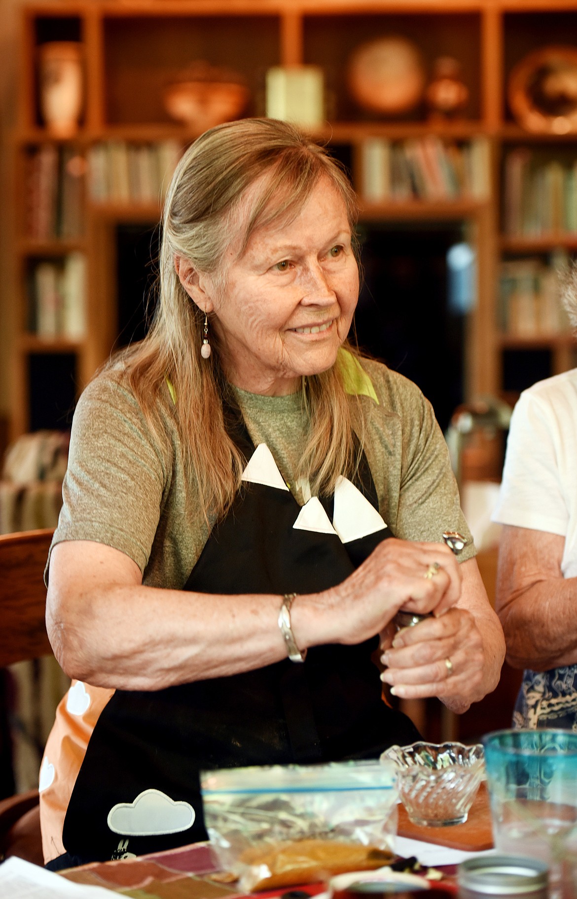 Glenda Smith of Whitefish listens to Julie Laing of Twice as Tasty as she explains differences in how Americans use spices as compared to how they are used in Indian cooking on Tuesday, July 10, in Whitefish.(Brenda Ahearn/Daily Inter Lake)Turmeric, dried smoked chilis, coriander seeds, cumin seeds, black peppercorns, brown mustard seeds, fenugreek seeds and whole cloves go into the making of the Basic Indian Masala taught by Julie Laing in the Twice as Tasty workshop on Indian Spices on Tuesday, July 10, in Whitefish.(Brenda Ahearn/Daily Inter Lake)A group of friends and hiking buddies of Glenda Smith gather in her kitchen on Tuesday, July 10, in Whitefish to take part in a workshop from Julie Laing of Twice as Tasty.(Brenda Ahearn/Daily Inter Lake)One of the most time consuming parts of making Garam Masala was the collecting of cardamom seeds from their pods.(Brenda Ahearn/Daily Inter Lake)From left, coriander seeds, cumin seeds, cloves and black peppercorns are some of the ingredients that go into the making of the Basic Indian Masala taught by Julie Laing in the Twice as Tasty workshop on Indian Spices on Tuesday, July 10, in Whitefish.(Brenda Ahearn/Daily Inter Lake)