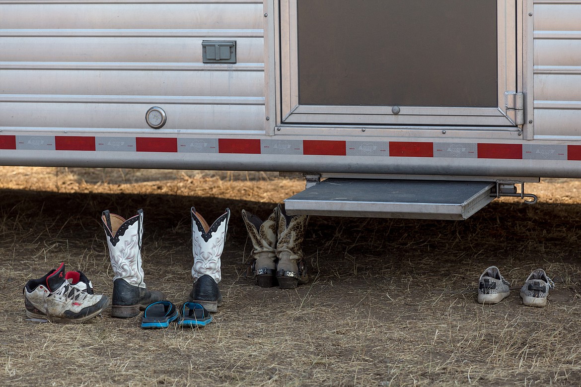 Sneakers and boots are left outside a trailer at the Kootenai River Stampede PRCA Rodeo in Libby Saturday, Aug. 5. (John Blodgett/The Western News)