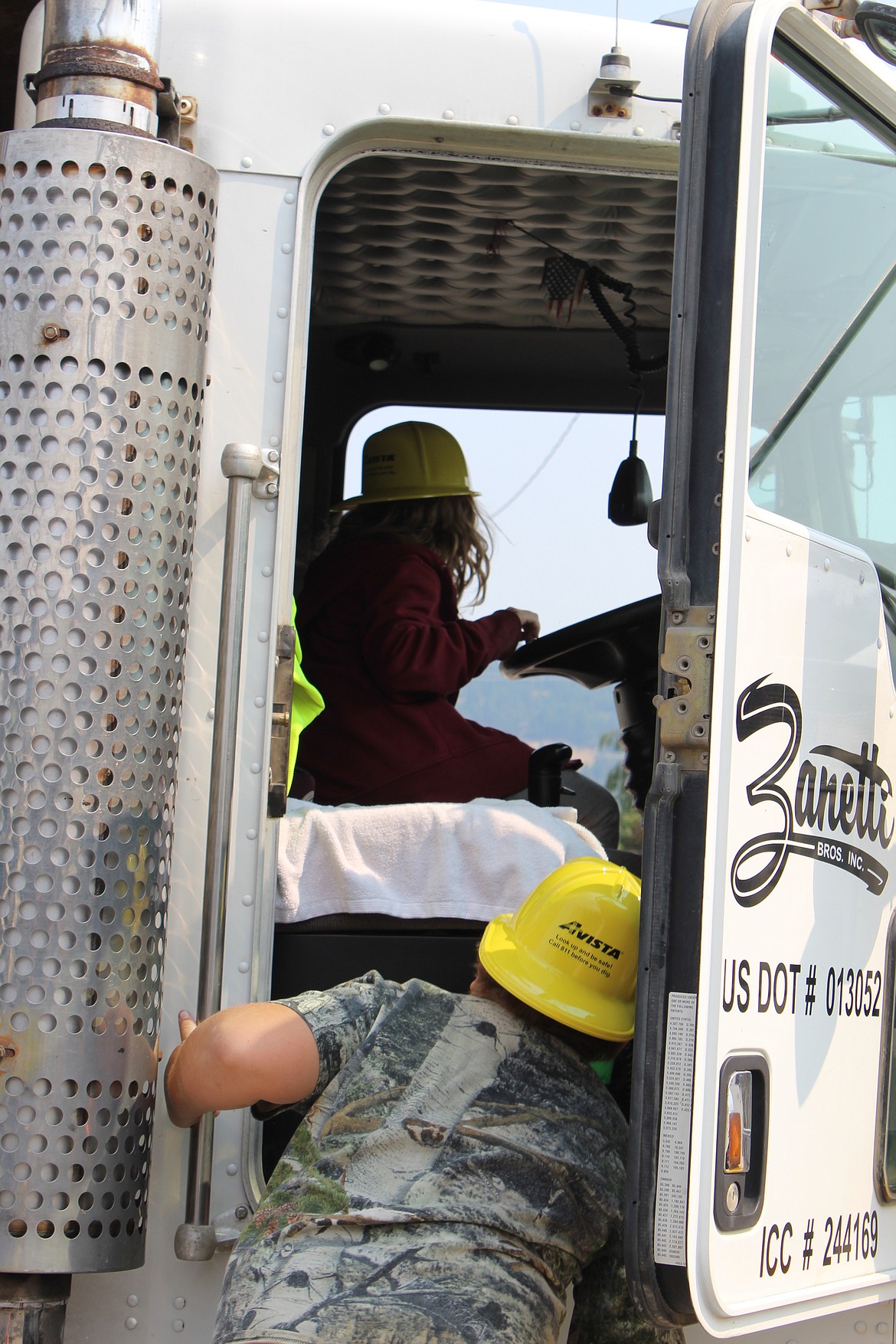 Kids explore the cab of a Zanetti work truck. They also couldn&#146;t pass up the opportunity to honk the truck horn.