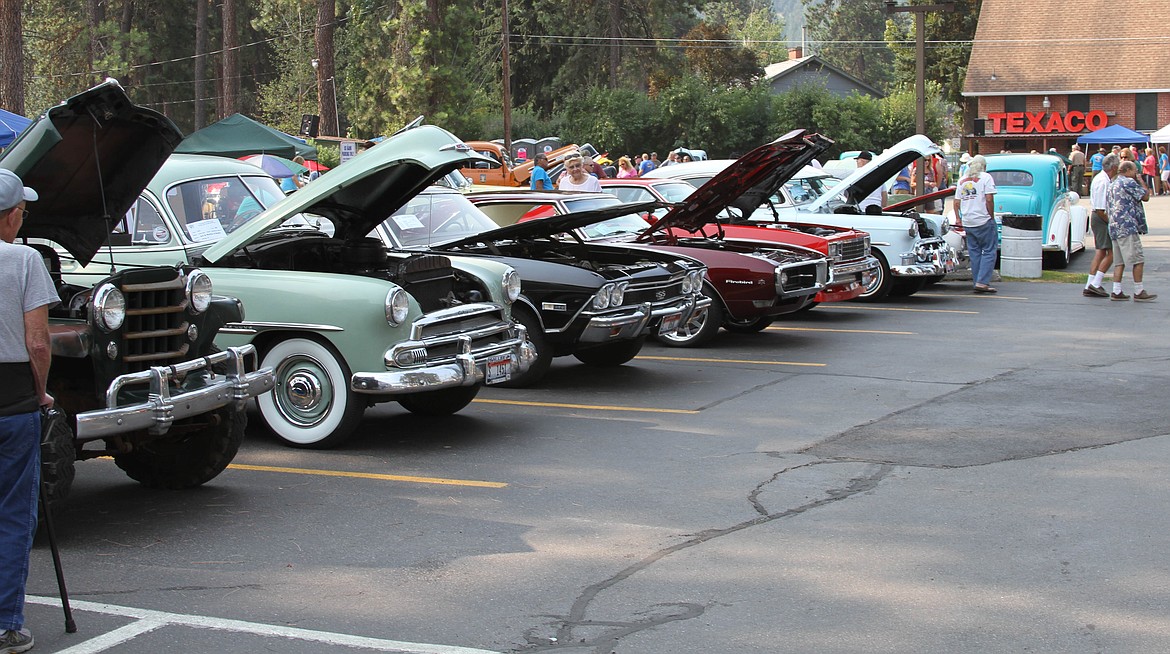 Spectators are able to get a look under the hoods of the classic cars at Pinehurst Days.