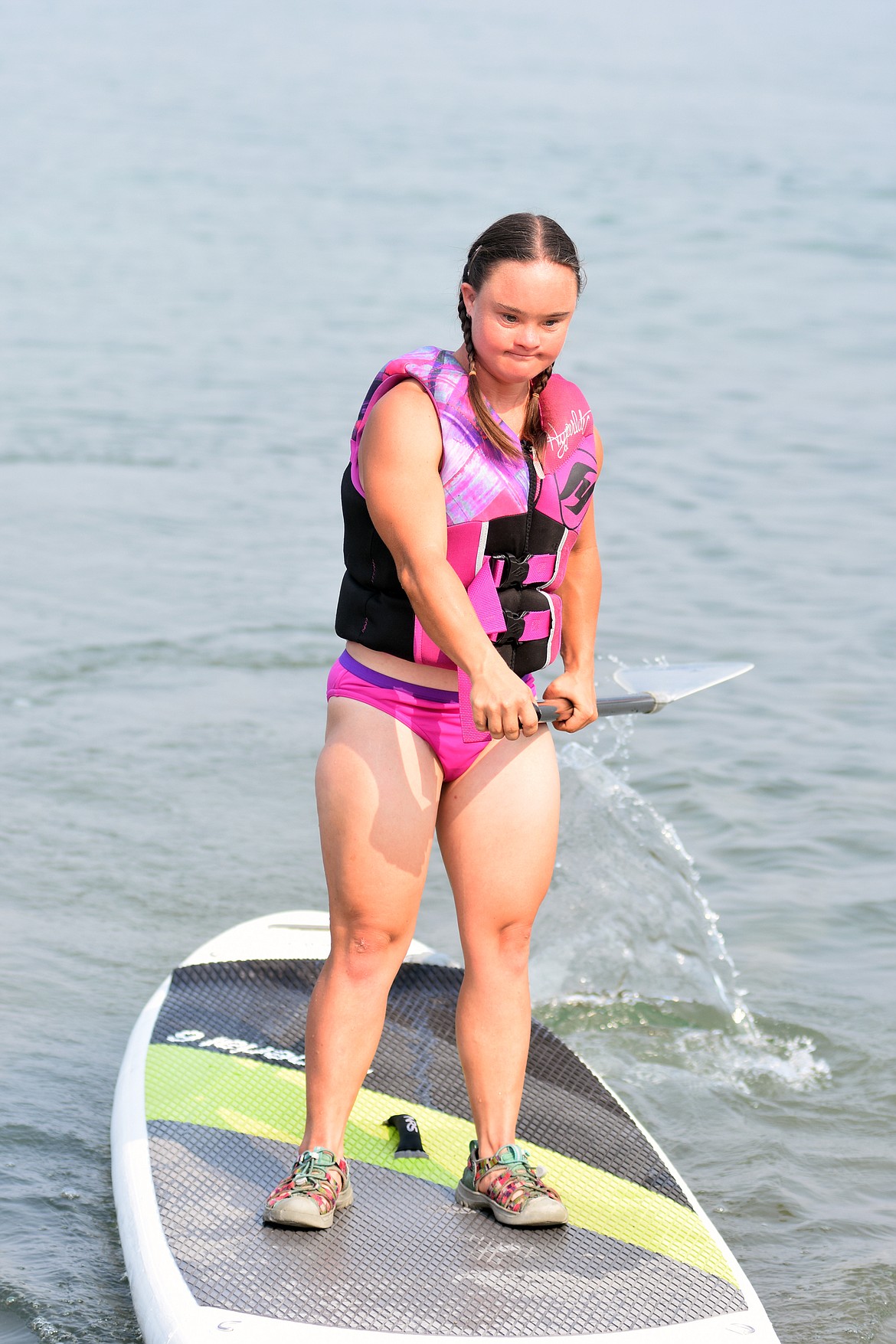 Cedar Vance comes in on her paddleboard Friday morning at City Beach as part of the DREAM Adaptive program. About 20 participants and 12 volunteers were part of the morning that included paddleboarding and kayaking.