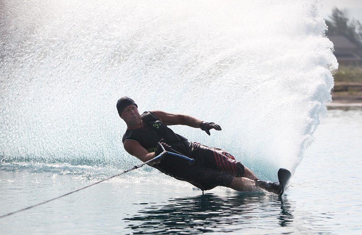 Water-ski competitor and Rosewater homeowner, Greg Alsbury water skis Wednesday at Rosewater water-ski community in Kalispell. (Mackenzie Reiss/Daily Inter Lake)