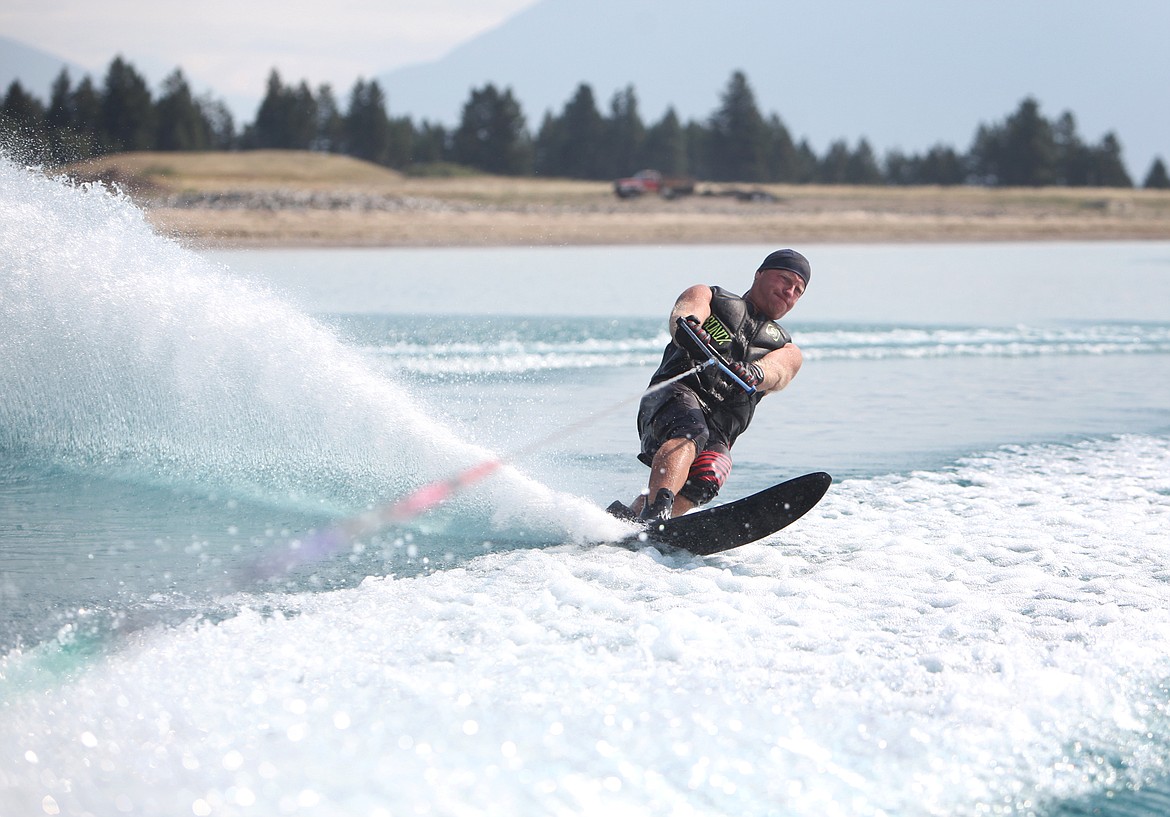 Water-ski competitor and Rosewater homeowner, Greg Alsbury water skis Wednesday at Rosewater water-ski community in Kalispell. (Mackenzie Reiss/Daily Inter Lake)