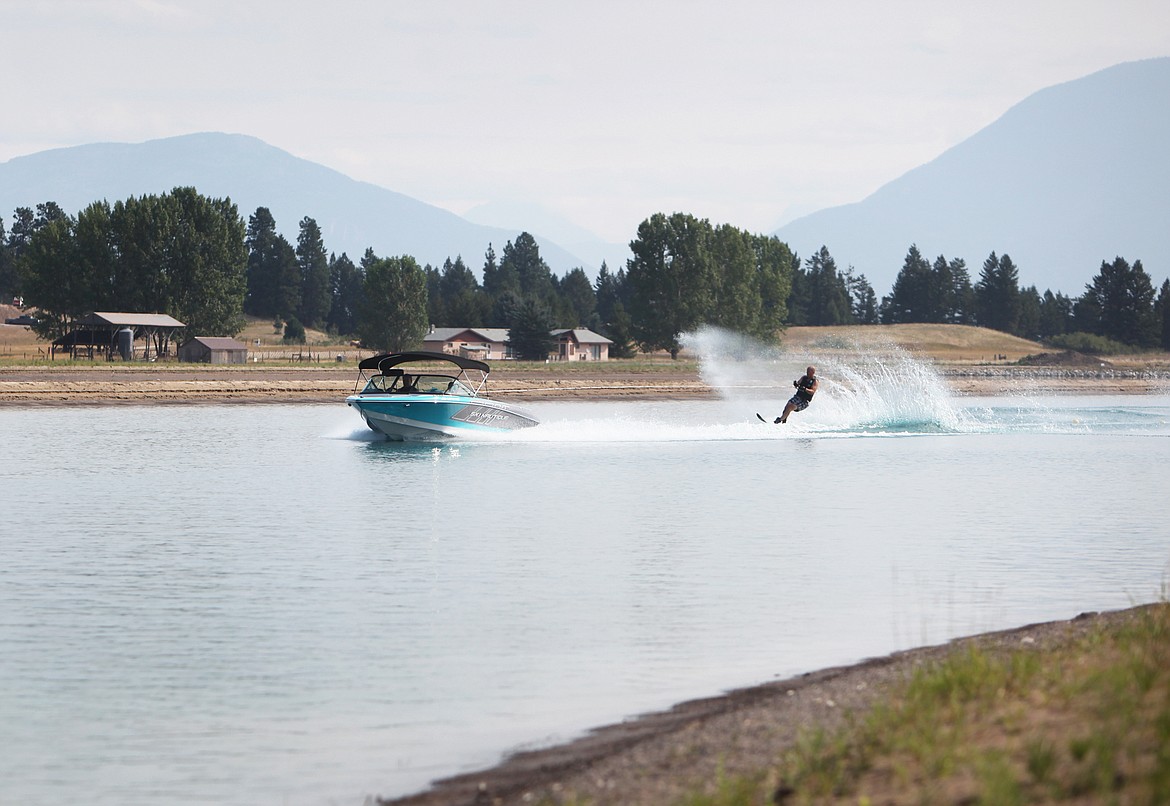 Russ Barnett, of southern Alberta, waterskis at Rosewater water-ski community in Kalispell. (Mackenzie Reiss/Daily Inter Lake)