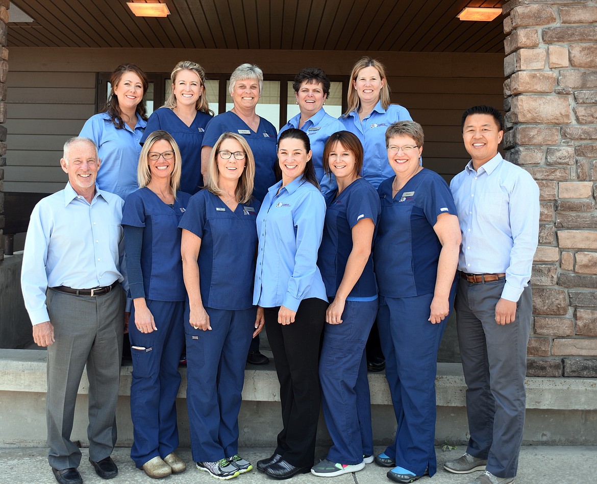 From left, row one: Dr. Michael Stebbins, Kris Nahrgang, Debbie Tkachyk, Kami Trimble, Katie Vandeburgh, Shawn Luoma, Dr. Young Stebbins-Han, row two: Holly Naldrett, Stephanie Krueger, Karla Butts, Brenda Hamilton, and Tina Colby gathered in front of their office, they won the&#160;Best Orthodontics category of the 2017 Best of the Flathead Poll.(Brenda Ahearn/Daily Inter Lake)