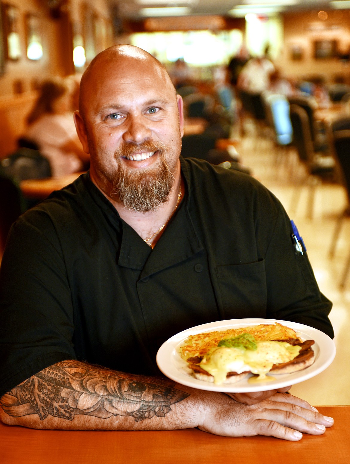 Rick Hasse with a plate of Bacon Avocado Eggs Benedict, which includes bacon, avocado, poached eggs, hollandaise, on English muffins with potatoes. Hasse has been chef at Sykes for six years and is now part owner with Jayson Peters and Ray Thompson. Sykes tied with the Echo Lake Cafe for best place for Sunday Brunch category in the 2017 Best of the Flathead Poll.(Brenda Ahearn/Daily Inter Lake)