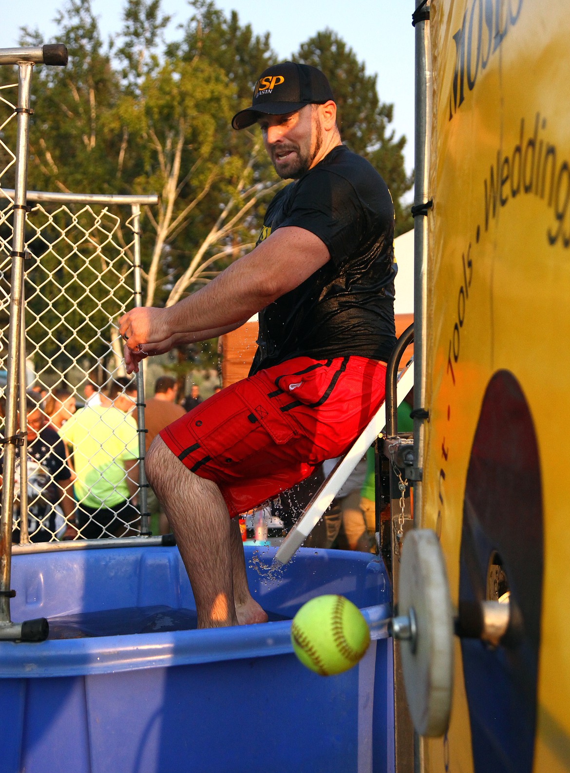 Rodney Harwood/Columbia Basin Herald
Patrolman Justin Cloud with the Washington State Patrol is on his way to the water in the dunk tank as part of the festivities during National Night Out Tuesday evening at McCosh Park.