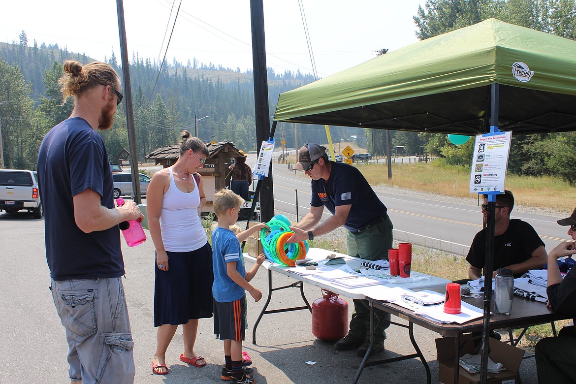 Shawn Jackson, BLM firefighter from Phoenix, talks about fire prevention and hands out some frisbees. Firecrews will be present as well at the Pinehurst Days parade on Saturday.