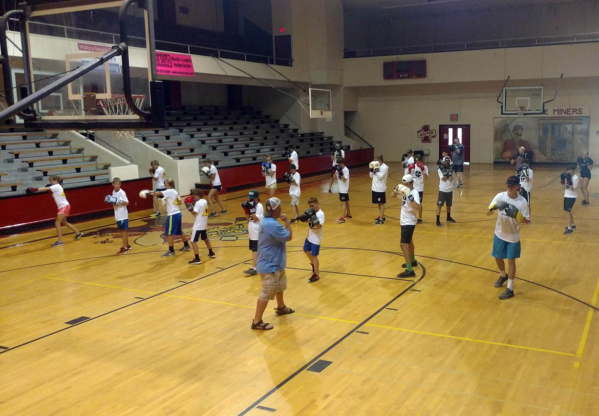 Coach Welliver demonstrates proper form during a shadow boxing session.