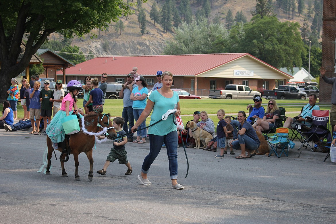 Teagan Frawly won first place in the &#147;Girl on Horse&#148; category at the Superior Fair Parade. She was led by her mom, Kaila Frawley. (Kathleen Woodford/Mineral Independent)