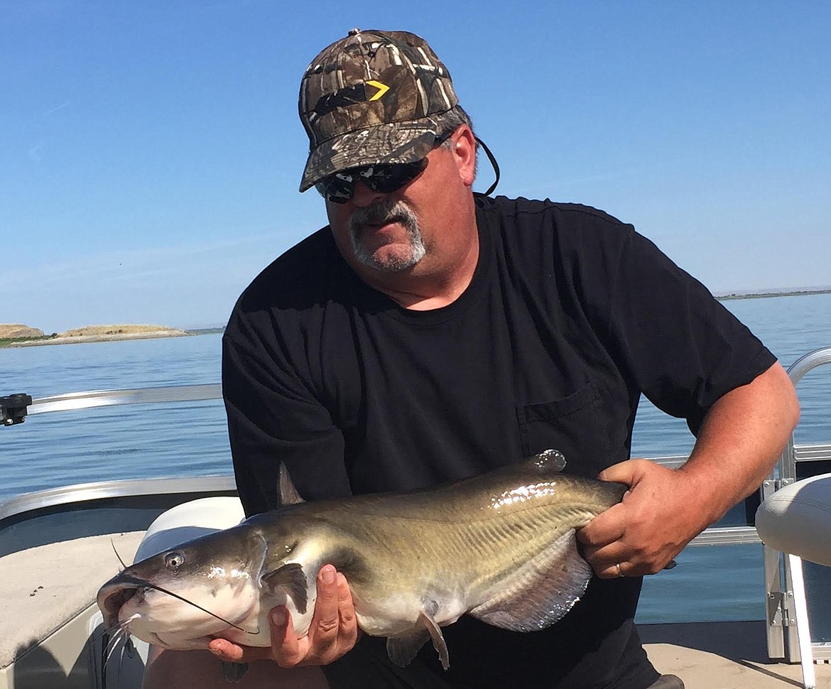 Pete Fisher photo - Duwayne Wolf with a big 10.80 pound Channel Cat.