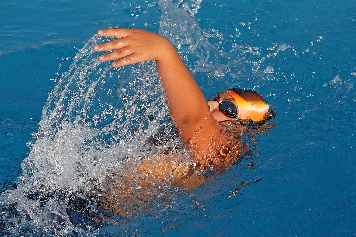 Bob Barrett photo - Noah Martinez swims the backstroke leg of the Boys 11-12 200 meter medley relay.