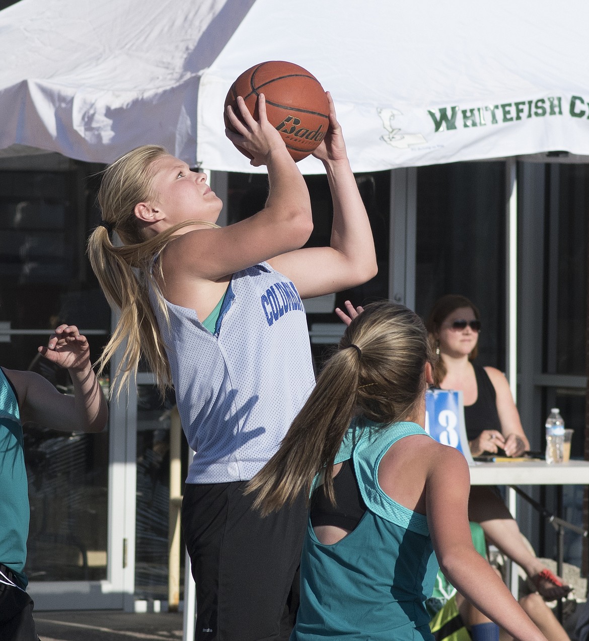 Trista Cowan takes a shot in the Heritage Days 3-on-3 basketball tournament.